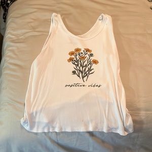 Medium size white shirt with flowers.very comfortable.